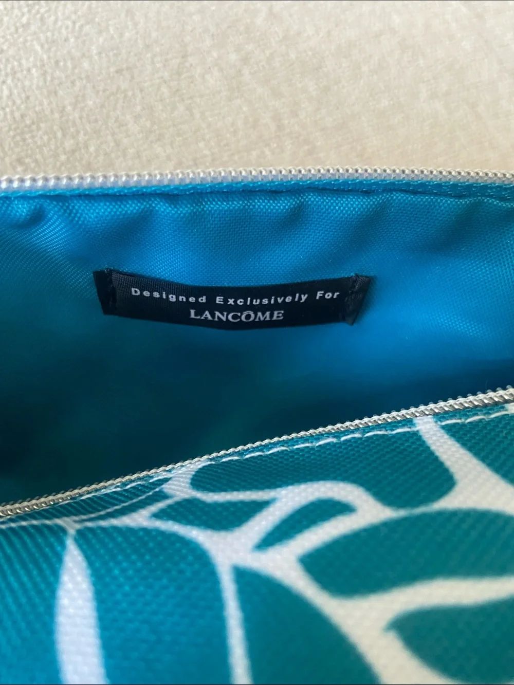 Lancôme Teal and White Floral Tubular Zip Pouch. New, Never used.
